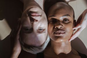 calm diverse women lying on floor