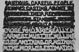 Artwork displays a quote with layered black and white text.